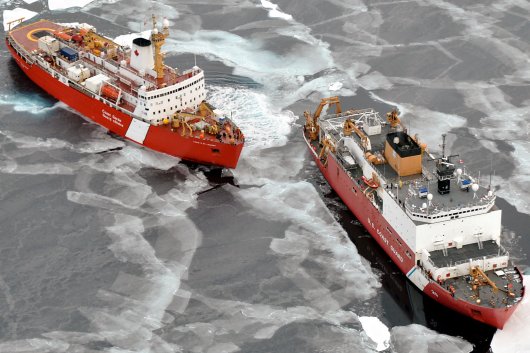 US Coast Guard vessels pictured in icy waters.