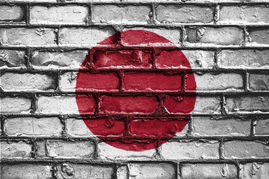 Japanese flag on a brick wall.