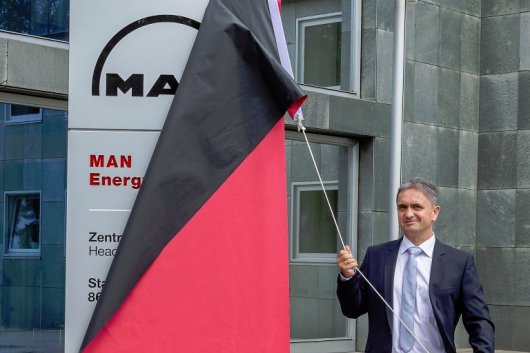 Dr Uwe Lauber, chairman of MAN Energy Solutions, unveils the new company name and branding at the firm's head office in Augsburg, Germany.