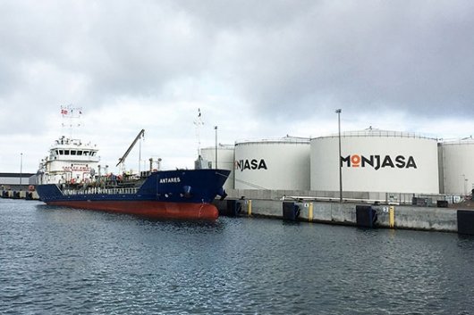 The M/T Antares, Monjasa's fixed bunker vessel at Skagen, berthed next to the company's fuel storage tank facility.