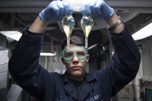 Fuel oil samples inspected for sediment and water in the oil lab aboard the amphibious assault ship USS Bonhomme Richard, on March 13, 2017.