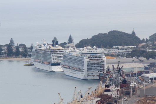 Cruise vessels Celebrity Solstice (front) and Golden Princess (back) docked at the Port of Tauranga, New Zealand.