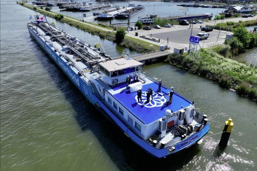 The signing ceremony, held on May 12, was held aboard one of GoodFuels' barges.