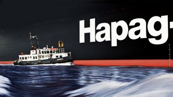 Hapag ship with small vessel next to logo.