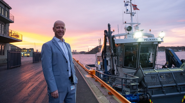 Port Director Ingvar M. Mathisen in front of Pelikan II vessel.