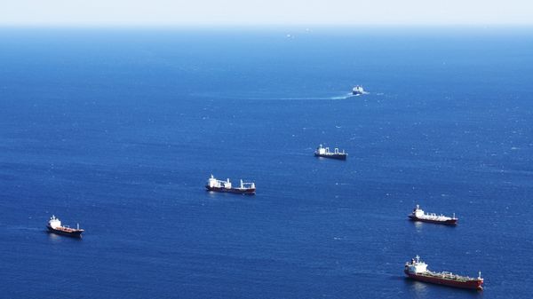 Aerial photograph of ships at sea.