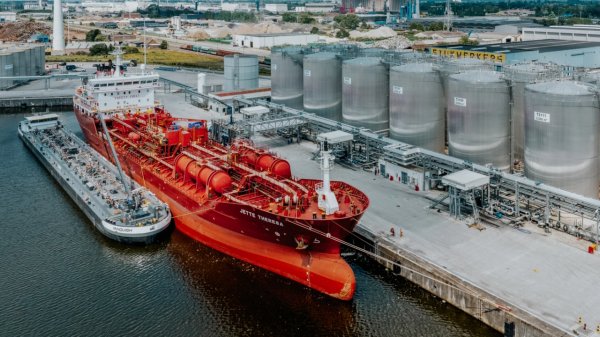 Vanquish tanker alongside Jette Theresa oil/chemical tanker docked at terminal.