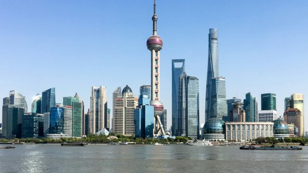 Phograph of Shanghai skyline with Oriental Pearl Tower in centre.