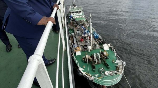 Bunker vessel alongside a ship during fuel transfer.