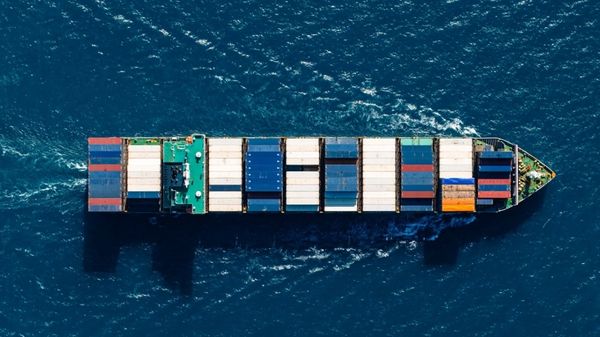 Aerial view of container vessel at sea.