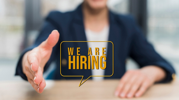 We are hiring graphic message with a handshake gesture.